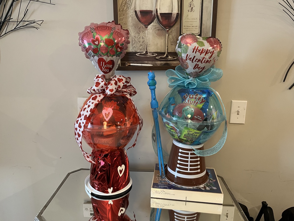 Valentine's Day balloon gift arrangements with hearts and gifts
